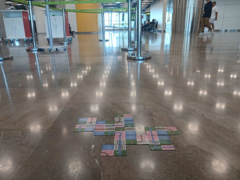 Naturopolis, a version of Sprawlopolis, being played in an airport by the author.