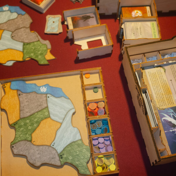 setting-up-a-game-of-spirit-island-on-a-red-board-game-table
